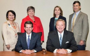 Madison Board of Education members are president Ray White, seated from left, superintendent Dr. Dee Fowler and Ranae Bartlett, standing from left, Connie Spears, Dr. Terri Johnson and David Hergenroeder. (CONTRIBUTED) 