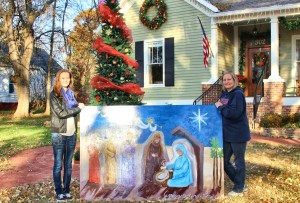 On "Christmas Card Lane" at 302 Church St., Rikki Powell, at right, and her daughter Morgan Thomas admire "The Manger," created by Carolyn Dodson-Grimm. (CONTRIBUTED) 