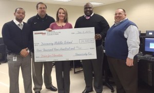 In its "Drive for Education" program, University Kia presented $4,500 to Discovery Middle School. Attending the presentation were, from left, Discovery assistant principals Ryan Foy and Kevin Wilson, Discovery Principal Melanie Barkley, University Kia General Manager Arthur Seaton and University Kia Sales Manager Mike Lucente. (CONTRIBUTED)