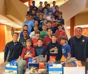Each year, the baseball team at Liberty Middle School donates food for Thanksgiving to local families. They also raise money to buy Christmas gifts for children in need. (CONTRIBUTED) 
