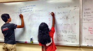 In exercises with Eat Pie Institute of Mathematics, an intern and a student contribute to problem writing and solving in MATHCOUNTS B study. (CONTRIBUTED) 