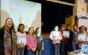 Hester Bass, at left, discussed and gave an audiovisual presentation about her book, "Seeds of Freedom," with fourth-graders at West Madison Elementary School. (CONTRIBUTED)