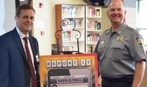 Madison County Schools Superintendent Matt Massey, at left, and Madison County Sheriff Blake Dorning revealed the SAFE-2-TELL tip line during a press conference at Madison County High School on April 9. (CONTRIBUTED) 