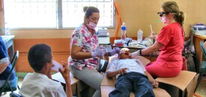 Madison Rotarian Dr. Amy Thompson of Thompson Dentistry, at right, assists Dr. Natalia Bustillo of San Francisco, Honduras in a temporary dental clinic coordinated by Rotarians from Madison and Calhoun City, Miss. (CONTRIBUTED)