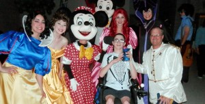 Liberty Middle School student Drew, center, shares laughs with Disney movie characters during the "Some Enchanted Evening" Reunion Dance. (CONTRIBUTED)