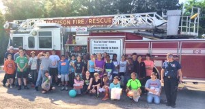 Capt. Russ Kennington and Station 2 Firefighters Brandy Williams and Ron Hopkins brought a ladder truck to Madison Elementary School for the sixth-graders' egg-drop experiments. (CONTRIBUTED) 