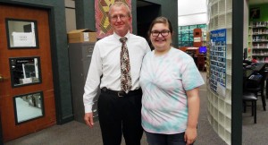 Shandi Burrows, at right, serves as the first teenager with Madison Friends of the Library board and works with president Dave Butler, at left. (CONTRIBUTED)