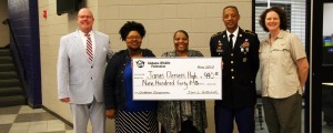 Alabama Wildlife Federation presented a grant for an outdoor classroom to James Clemens High School. Principal Dr. Brian Clayton, at left, accepted the grant, along with teachers Brittany Bankston, Patricia Williams and retired Sgt. Maj. Samuel McCray. April Waltz, at right, is the federation's outdoor classroom coordinator. (CONTRIBUTED) 