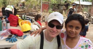 Matt Curtis takes a break from homebuilding with Giveback Homes in Nicaragua to accept a hug from a young girl. (CONTRIBUTED) 