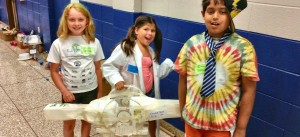 On Scientist Day at Camp Invention, campers Catrina, Karli and Vishal show their design for an 'invisible suit.' (CONTRIBUTED) 