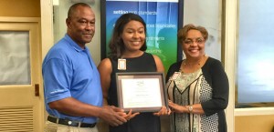 Jazelyn Little, at center, earned a $2,000 scholarship from Ascend Cares Foundation. Jazelyn's parents J.B. and Angela Little congratulate her. The family lives in Harvest. (CONTRIBUTED) 