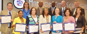 Madison City Schools principals received accreditation certificates at a recent board meeting. These leaders are Dr. Daphne Jah, front from left, Dorinda White, Carmen Buchanan, Melissa Mims, assistant principal Sharon Nichole Phillips and coordinator of secondary instruction Dr. Heather Donaldson. Jamie Hill, back from left, Sylvia Lambert, Eric Terrell, Rodney Richardson, Dr. Brian Clayton and superintendent Dr. Dee Fowler. Nelson Brown and Dr. Georgina Nelson are not pictured. (CONTRIBUTED) 