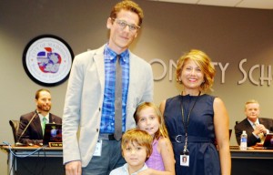 Daniel Whitt, Coordinator of Instructional Technology for Madison City Schools, pauses with his wife Jennifer and their children, Silas and Stella. (CONTRIBUTED) 
