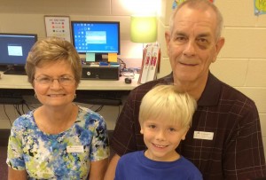 Karen and Alan Douglass visited with grandson Kyle during Grandparents' and 'Grand-friends' Day at Mill Creek Elementary School in 2014. Mill Creek will honor grandparents this year on Sept. 10-11. (CONTRIBUTED) 
