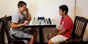 Michael Guthrie, at left, and Om Badhe play a leisurely game of chess back home after competing in the Chris Bond Memorial Chess Tournament in Montgomery. (CONTRIBUTED) 