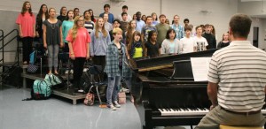 Randall Fields, in foreground, rehearses chorus students at Bob Jones High School. Bob Jones Chorus will present their "Coffee & Cake Concert" on Sept. 24 at 7 p.m. in Zompa Auditorium. (CONTRIBUTED) 