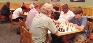 Competing at the first meeting of Madison-Huntsville Chess Club are Wally Malmburg playing Jenson Wilhelm, in foreground, Undrea Randolph, Luis Morenilla, Dr. Paul Mulqueen, Scott Edwards and Russell Freeman. (CONTRIBUTED) 