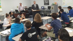 Attorney Shay Golden, at podium, briefed students in Cory Wright's advanced-placement government class at Bob Jones High School before they attended a trial with the Alabama Supreme Court. (CONTRIBUTED) 