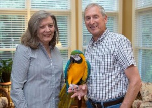 Ann and Vic van Leeuwen are the "adopted parents" of Merlin the macaw, who actually belongs to their son Dan. (Photo/JFD Photography)  