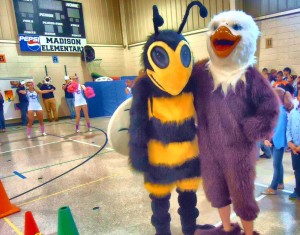Buzz the Hornet and the Horizon Eagle boosted energy during the Mad Dash Pep Rally at Madison Elementary School. Also lifting school spirit were the cheerleaders from James Clemens High School (at back of photo). (RECORD PHOTO/GREGG PARKER) 