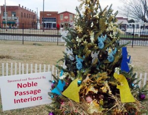 Groups, businesses and individuals can enter the 2015 Madison Mayor's Christmas Tree Decorating Contest. Trees will decorate Main Street in downtown Madison. Noble Passage Interiors decorated this tree in 2013. (RECORD PHOTO/GREGG PARKER)