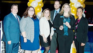 William Murray, from left, Abigail Stapler, Susan Owens, Jonathan Muecke, Larissa Moore and Beth Richardson of Madison’s Progress Bank hold the Small Business of the Year award. CONTRIBUTED