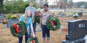 Helping with wreaths for veterans' graves in 2014 were Jackie Barnett, from left, Jonah Jenkins and Akeia Williams, who in 2014 were in JROTC at Bob Jones High School. CONTRIBUTED