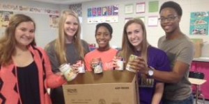 Beta Club members Molly See, from left, Megan Ponder, Ari Alexander, Serena Bukovac and Brandon Pitts pack a box for "Project Pantry." CONTRIBUTED