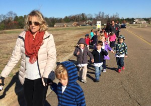 : Pre-kindergartners, teachers and parents from Primrose School of Madison walk to Kroger to buy food for their can-a-thon. CONTRIBUTED