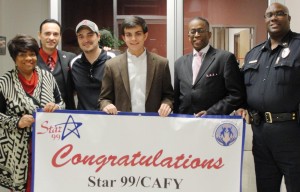 Jordan Cozby receives congratulations from organizers for "Young Citizen of the Month," sponsored by Community Awareness for Youth (CAFY) and Star-99. CONTRIBUTED