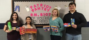 As members of Bob Jones S2S Peer Helpers, Ashley Romans, from left, Suzi Day, Katlyn Teague and Tucker Walters hold some donations for the Patriot Pantry. CONTRIBUTED