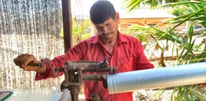 A Honduran villager works on an EcoStove chimney. Rotary Club of Madison has completed a two-year project for $45,000 to install EcoStoves in Honduras. CONTRIBUTED