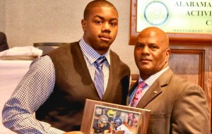 LaBryan Ray received his award for "Lineman of the Year" for 7A from Alvin Briggs, Director of Alabama High School Athletic Directors and Coaches Association. CONTRIBUTED/Dennis Victory, Alabama Sports Writers Association