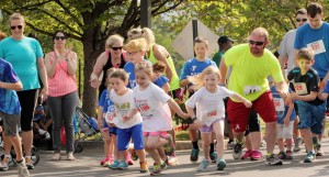 Encouraged by parents, children dash from the start line at a fun run during the YMCA's Healthy Kids Day. CONTRIBUTED/Heart of the Valley YMCA