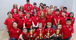 All eight teams from Rainbow Elementary School stand with their first- and second-place trophies at 2016 State Chess Championship. CONTRIBUTED