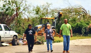 Volunteers survey the damage during recovery efforts for the tornado outbreak on April 27, 2011. CONTRIBUTED