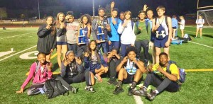 James Clemens track team members flash “four’’ after winning the school’s fourth straight junior high school track championships. CONTRIBUTED