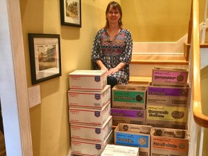 Marcie Kennedy stands by 72 boxes of cookies from Girl Scout Troop 719. Kennedy shipped cookies to troops, including daughter Lesli Kennedy, deployed to Afghanistan. CONTRIBUTED