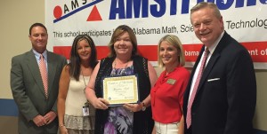 Jacqueline Smith, center, accepts a scholarship from School Superintendents of Alabama and Chalkable, with congratulations from Robby Parker, from left, Carmen Buchanan, Jenny Scott with Chalkable and Dr. Dee Fowler. CONTRIBUTED