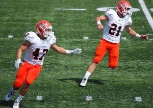 Dylan Haraway (#21), at right, runs a play for the Georgetown College Tigers with his brother Dustin Haraway (#47). 