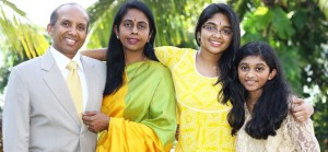 Meenu Bhooshanan, far right, stands with her family. CONTRIBUTED
