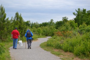Two people check out an improved trail at Harvest Square Nature Preserve. CONTRIBUTED