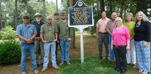 Inspecting the historic marker from the Alabama Historical Commission at Old Madison Cemetery are Shawn Hardy, from left, Elbert Balch, Matthew Phelps, Shane Willis, Colby Smith, Gerald Clark, Kent Smith, Cindi Sanderson, Dottie Magee and Jeanne Steadman. RECORD PHOTOS/GREGG L. PARKER