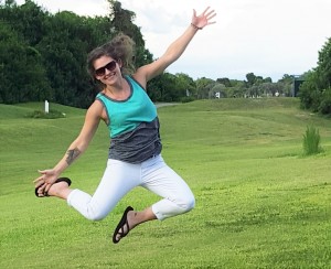 Julia Nagle takes a gleeful jump on the golf course. She is Columbia's Teacher of the Year. CONTRIBUTED
