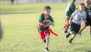 Caleb Barksdale hustles to gain yards in flag football. CONTRIBUTED