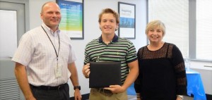 Davis Bowman of Madison, center, has been awarded a $2,000 scholarship from the Ascend Cares Foundation. Stephen French, plant manager in Decatur, and Lori Collins, human resources business partner, congratulate Bowman. CONTRIBUTED