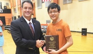 Lawrence Zhang, then an eighth-grader at Liberty Middle School, accepts the Mayor’s Award of Academic Excellence in Mathematics from Mayor Troy Trulock. CONTRIBUTED