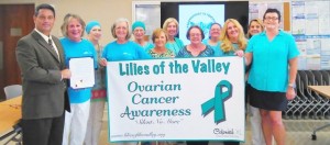 Madison Mayor Troy Trulock presents a proclamation for September as Ovarian Cancer Awareness Month to the Lilies of the Valley organization. CONTRIBUTED