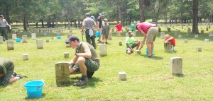 Scouts in Troop 350 clean gravestones at Stones River National Battlefield in Murfreesboro, Tenn. CONTRIBUTED