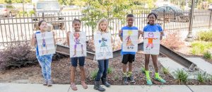 Boys and girls proudly show their art creations during the 2015 SPACES Artventure. Contributed/Heartstrings Photography by Heather